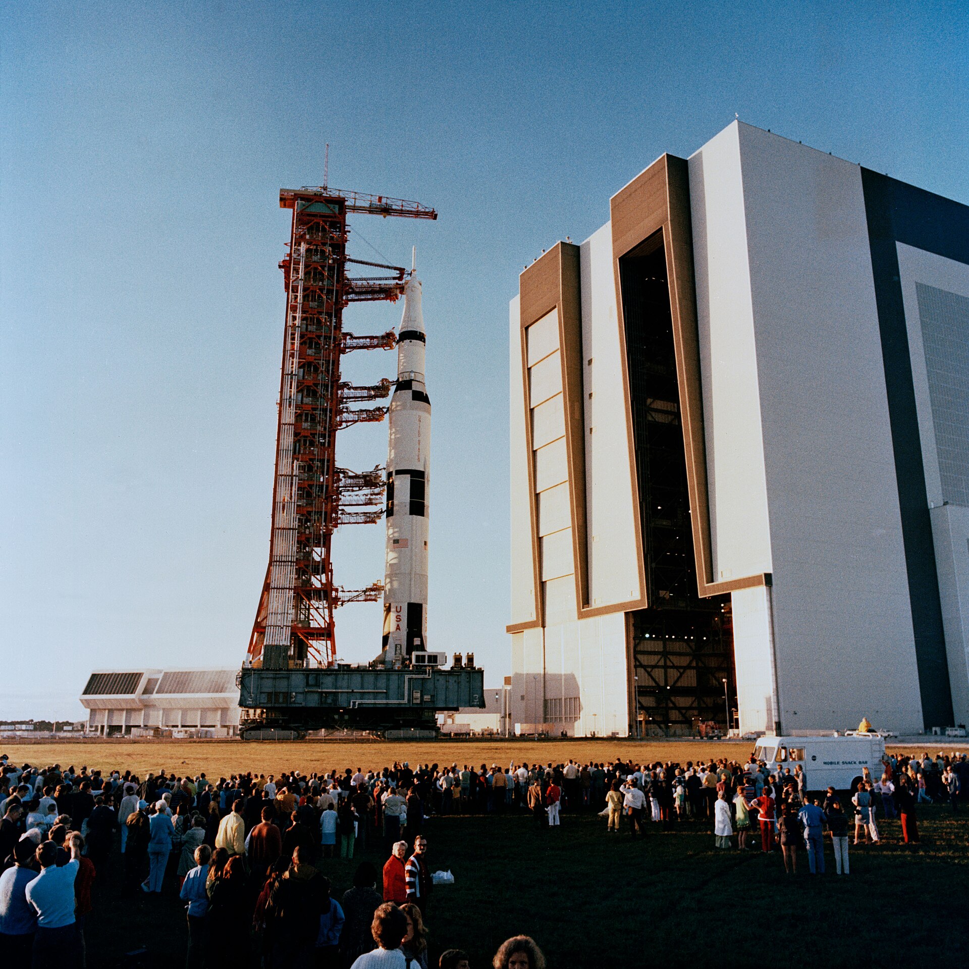 Apollo 16 Saturn V rolls from the Vehicle Assembly Building toward Pad 39A, April 1972.